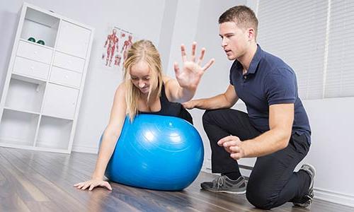 student working with a patient